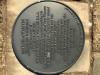 Round metal plaque