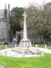 Cross on tapering plinth