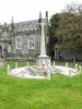 Cross on tapering plinth