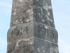 The dates 1914 1915 carved into the upper part of the obelisk