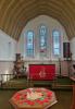Church interior, with memorial font in foreground.