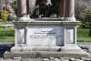 Pagoda shaped monument with bell and inscription