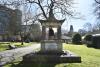 Pagoda shaped monument with bell and inscription