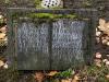Stone family gravestone shaped like an open book