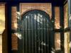 Close view of entrance with dedicatory panels above and to sides of door