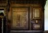 Wooden screens with inset panels with inscriptions