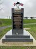 Monument front face inscribed with short dedication and names of individuals and groups involved in the creation of the  monument. special thanks to  