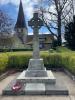 Old Harlow cross with church in background