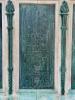 Five bronze plaques mounted on each side of large stone plinth