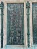 Five bronze plaques mounted on each side of large stone plinth