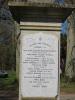 Plain cross atop square column with inscription
