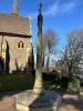 Octagonal cross on octagonal base with names inscribed at base