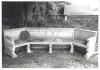 Stone bench with a wreath laid on it