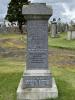 Granite pillar shaped gravestone