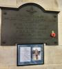 The plaque, with biography below