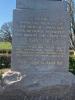 Front of the stone base with the memorial inscription. It is written in gold.