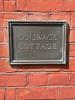 Courage Cottage plaque