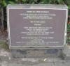 Stone plinth with 2 inscribed metal plaques