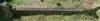 A kerb as part of a kerbed family plot with two names in addition to that remembered.