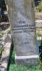 A column in a kerbed grave area with a cherub on the top and 2 names engraved in addition to those remembered. East side