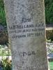 A column in a kerbed grave area with a cherub on the top and 2 names engraved in addition to those remembered. West face