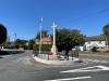 Stone cross in centre of road