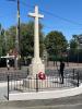 Stone cross in centre of road