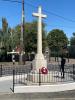 Stone cross in centre of road