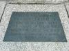 Plaque on paving.