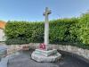 Cross on stepped base with hedge surround