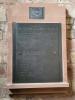 Slate tablet on sandstone surround inscribed with VC recipients