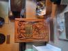 A piece of oak carved in the form of a book, made from wood salvaged from the training ship HMS Eurydice. Carved in relief on the front with a foundering ship surrounded by rope and flags at half-mast. Carved on the back with a ship in full sail. With a brass plaque and inscription commemorating the loss of the ship.