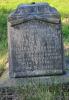 A plinth with a detached and missing top and two names in addition to that remembered