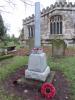 Broken granite column on stepped base