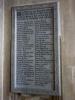 Rectangular stone tablet with incised names. 1 of 2.