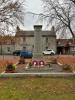 Cenotaph shaped shaft set on a three tiered rectangular base and two steps.