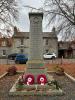 Cenotaph shaped shaft set on a three tiered rectangular base and two steps.