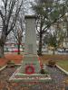 Cenotaph shaped shaft set on a three tiered rectangular base and two steps.