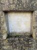 Stone tablet mounted in a wall dedicating the original fountain to the poor of Gretton