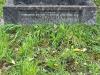 Close up of lowest grey granite square plinth containing the commemoration inscription