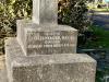 Close up of commemoration on the left hand side of the upper grey square granite plinth.