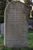 Headstone with grey inscription on the front. 