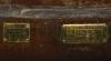 Brass plaques on lower wood
