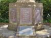 Stone plinth with inscribed metal plaques