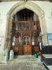 Oak panelling within stone arch.