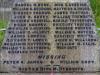 Names in leaded lettering on stone memorial base.