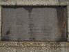 List of names incised on stone plaque.