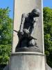 Sculpture of a man breaking a stone.
