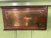 Brass plaque.