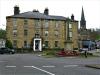 Bakewell WW1 Cross Memorial, with Rutland Arms Hotel in background.